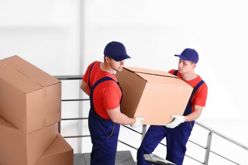 Man and van removal team loading boxes in Lambeth