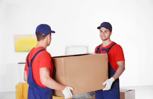 Furniture and boxes being unloaded at a Lambeth property