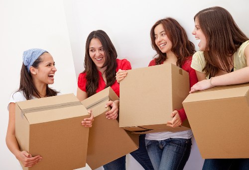 Careful packing of files, monitors, and office supplies for relocation