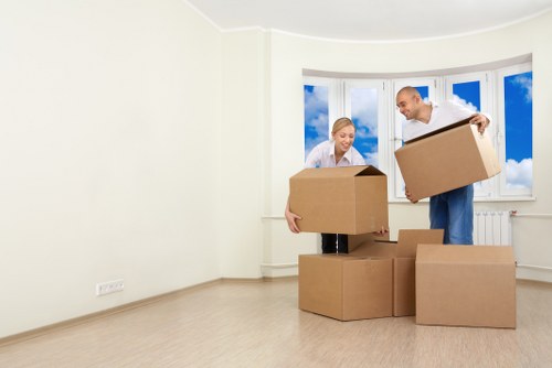 Professional removal team reviewing health and safety procedures