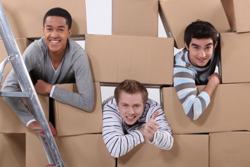 Safety-focused moving crew securing items inside a van