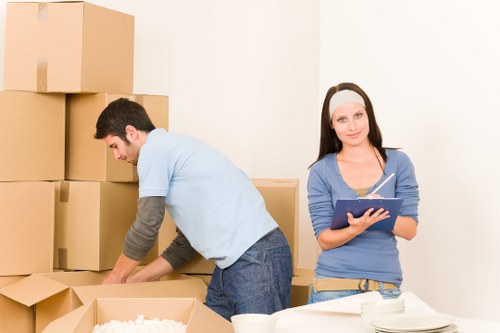 Professional movers handling furniture in a Lambeth flat move