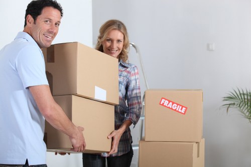 Loading boxes and household items into a moving van in Lambeth